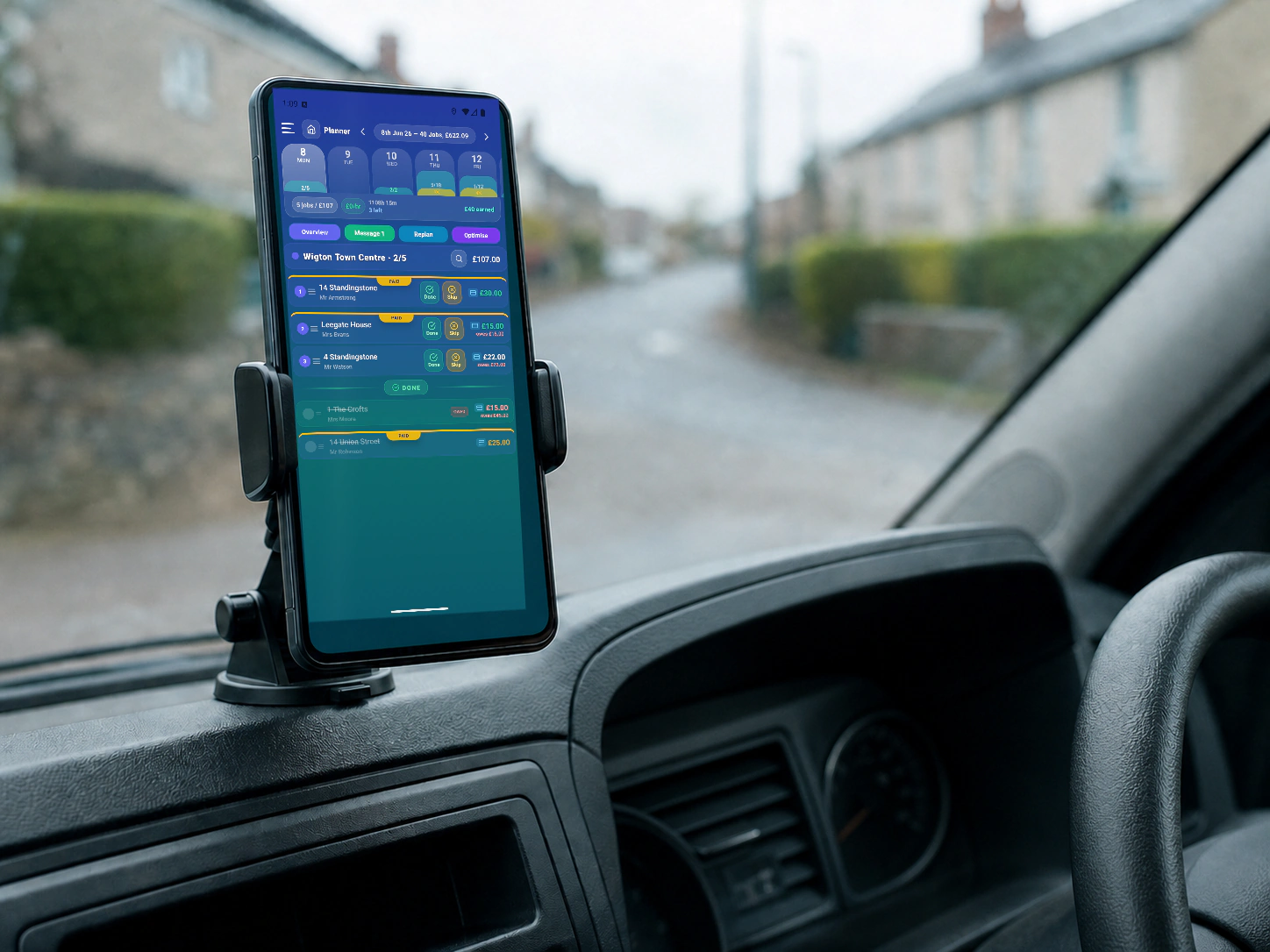 RoundRun daily planner displayed on a dashboard-mounted phone between jobs